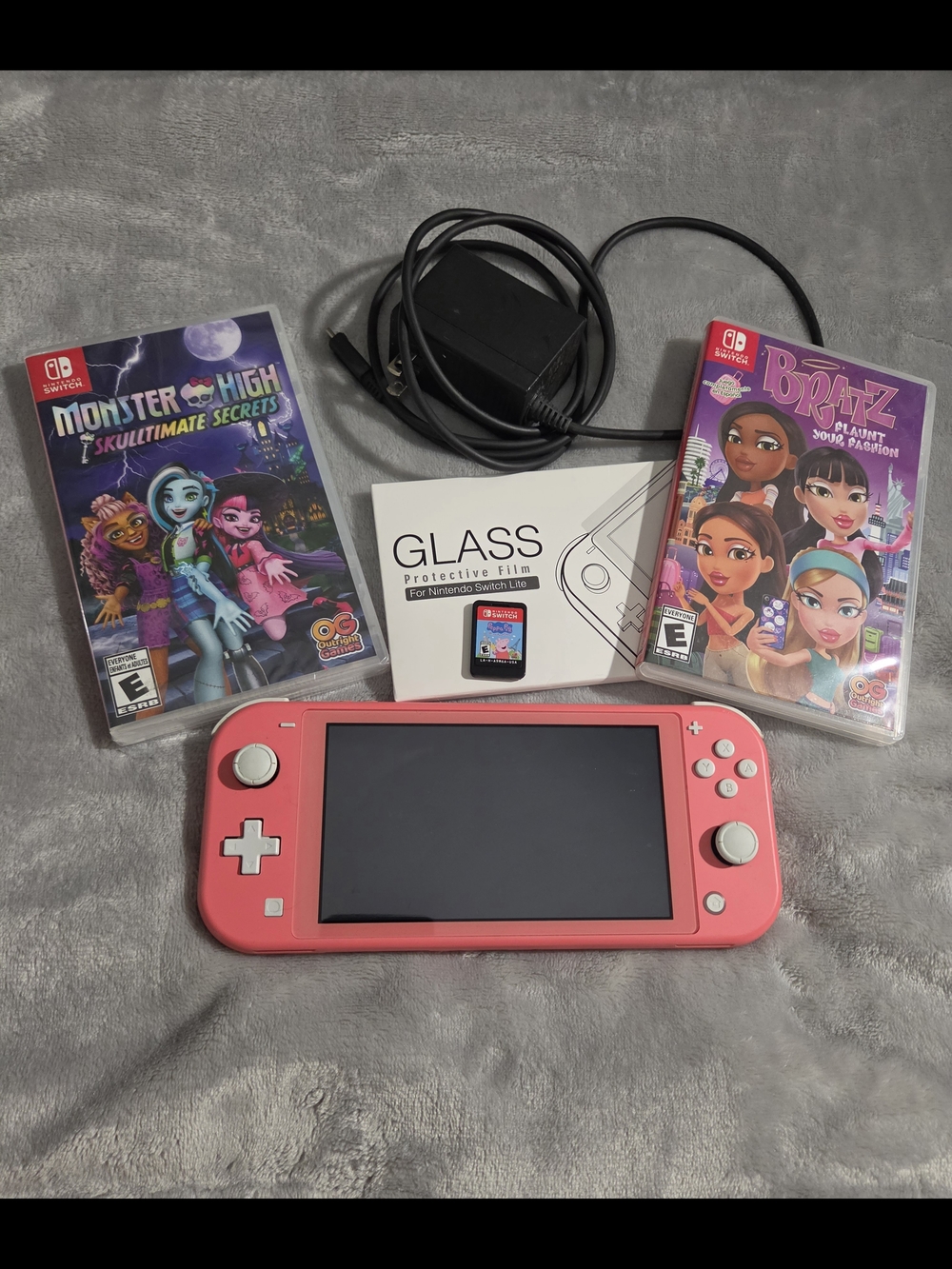 Nintendo Switch Lite Coral with Bratz, Monster High, & Peppa Pig Games, Charger